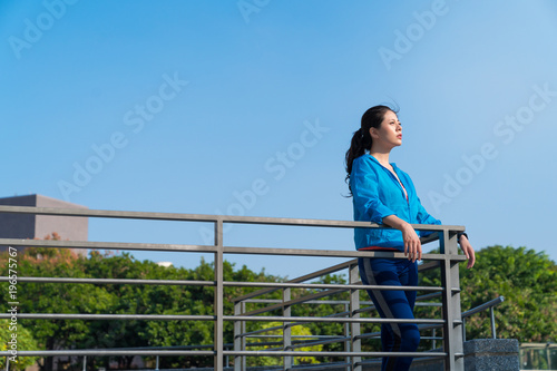 Runner relaxing after working out outdoors.