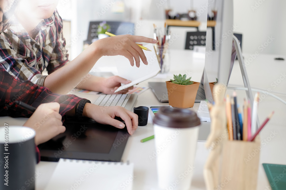 Graphic designer using digital tablet and computer Graphic designer using digital tablet and computer