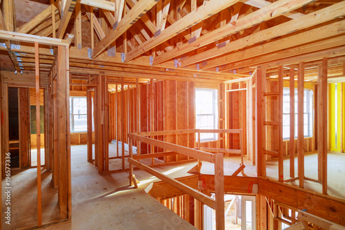 New home construction with wooden house frame