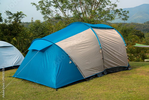 Set up a tent on the grass green. © supattra