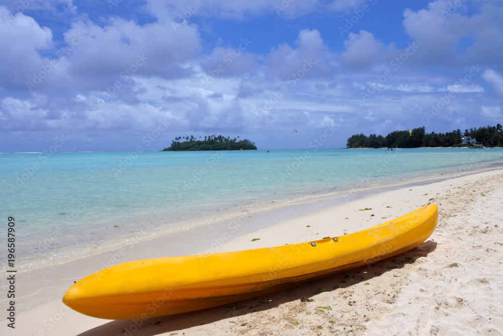 Yellow Kayak on Muri beach lagoon in Rarotonga Cook Islands Yellow Kayak on Muri beach lagoon in Rarotonga Cook Islands