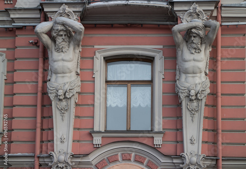 St. Petersburg, Russia, 5 March 2018,  sculptural figures of the Atlanteans, architectural decorations of facade building photo