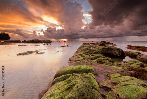 Sunset seascape with natural coastal rocks  at Kudat, Sabah Malaysia.