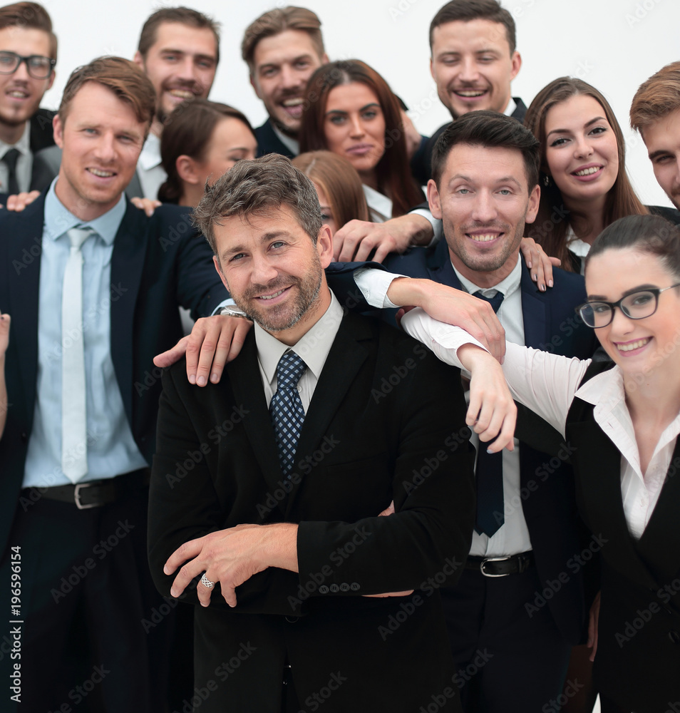 confident businessman standing on background of her business team. confident businessman standing on background of her business team.
