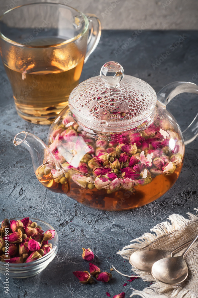 Teapot with detox drink from flower buds dry red pink rose tea w Teapot with detox drink from flower buds dry red pink rose tea w