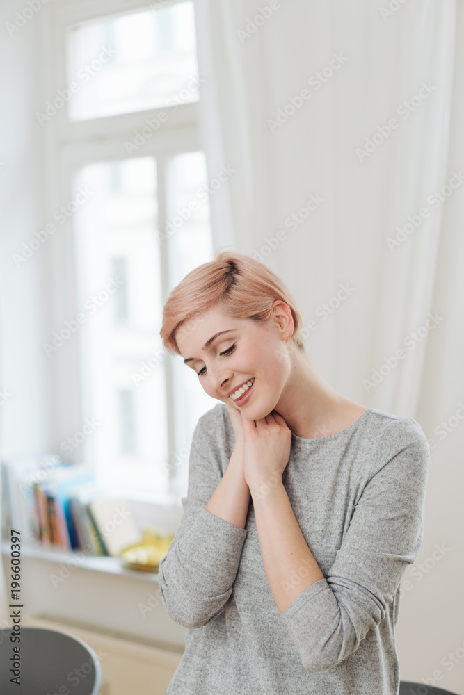 Pretty cute young woman standing daydreaming Pretty cute young woman standing daydreaming