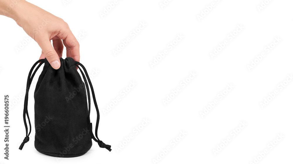 Black textile sack in hand isolated on white background. copy space, template Black textile sack in hand isolated on white background. copy space, template
