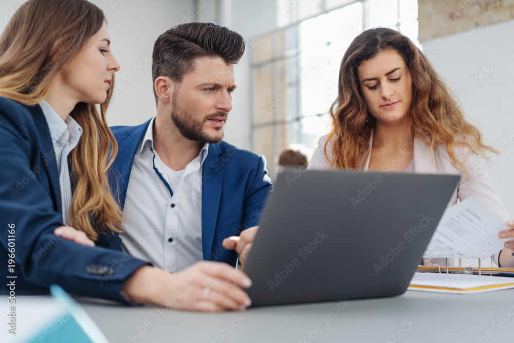Young manager working with his team Young manager working with his team