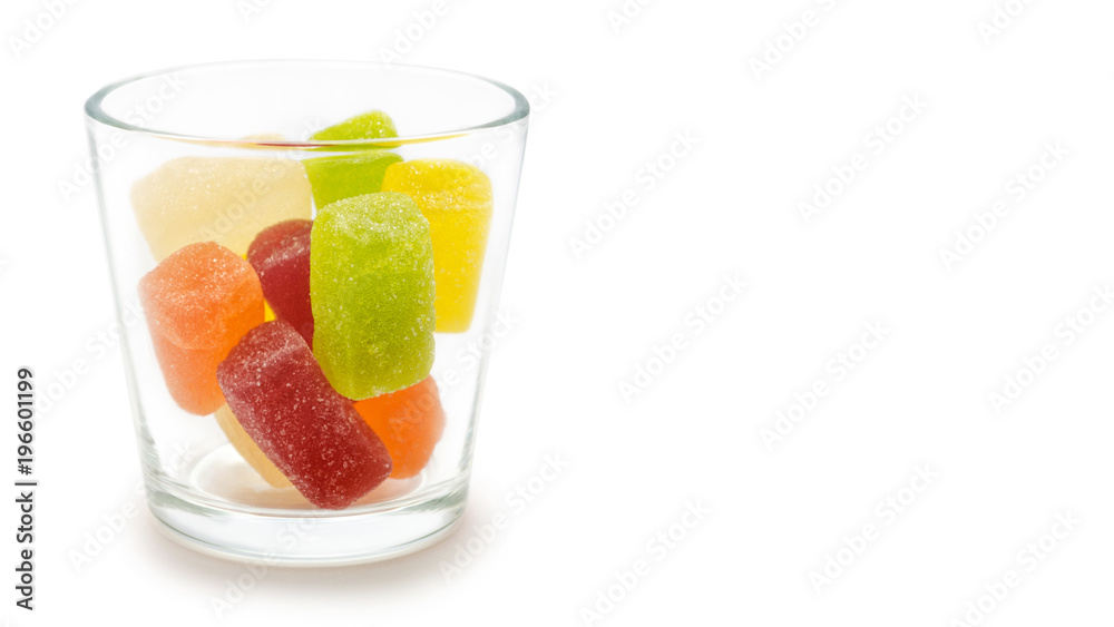 transparent glass with jelly candies. Isolated on white background. copy space, template. transparent glass with jelly candies. Isolated on white background. copy space, template.