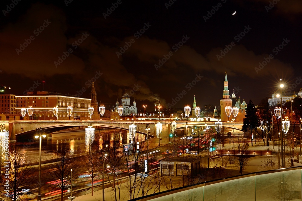 Moscow Kremlin With Illumination Of Cars On Road in the winter , Russia