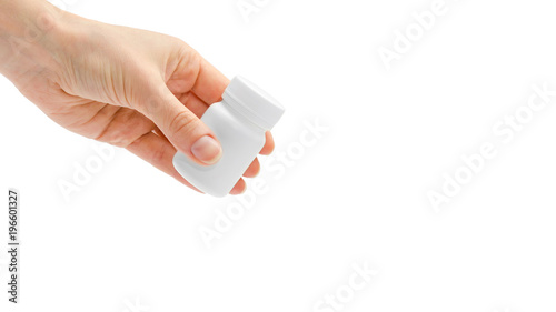 woman hand holding white medicine bottle. Isolated on white background. copy space, template.
