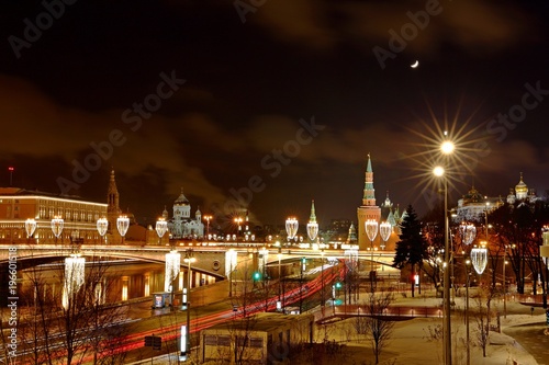 Moscow Kremlin With Illumination Of Cars On Road in the winter , Russia