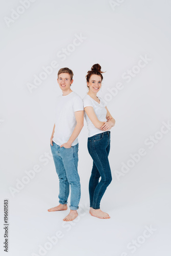 Relaxed young barefoot couple in jeans