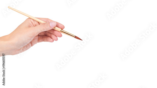 paint brush in hand isolated on white background. copy space, template