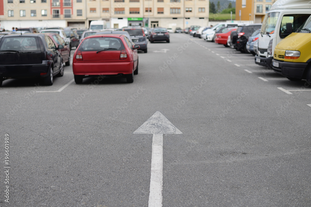 cars parked in a row on a city street