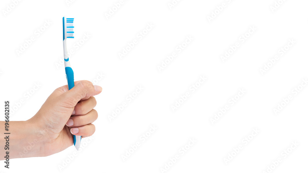 Hand holding tooth brush isolated on white background. copy space, template Hand holding tooth brush isolated on white background. copy space, template