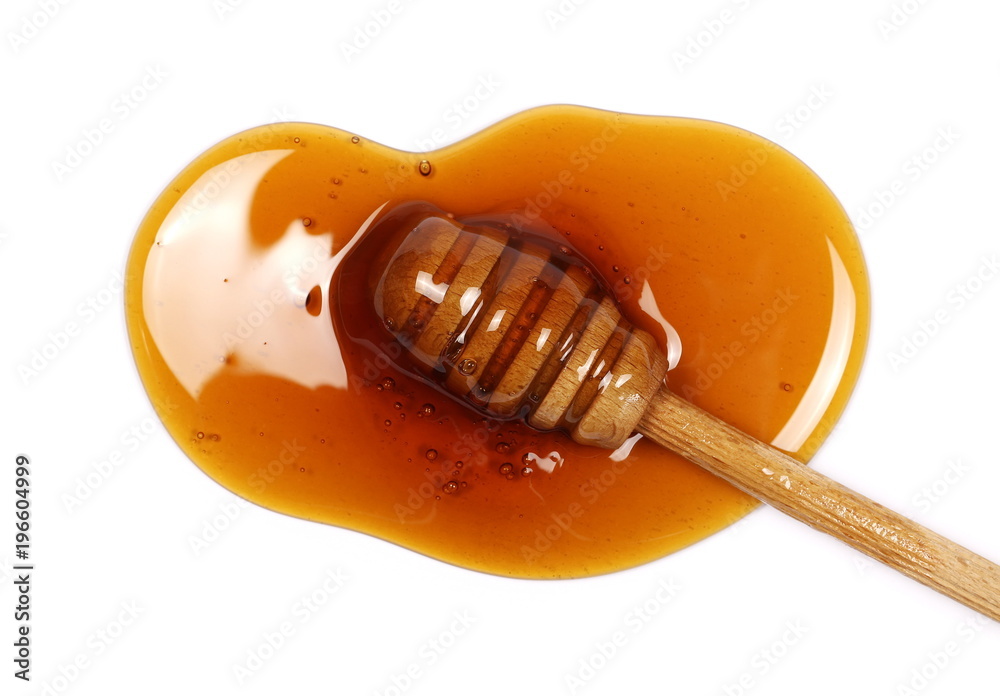 Honey and wooden dipper isolated on white background, top view Honey and wooden dipper isolated on white background, top view