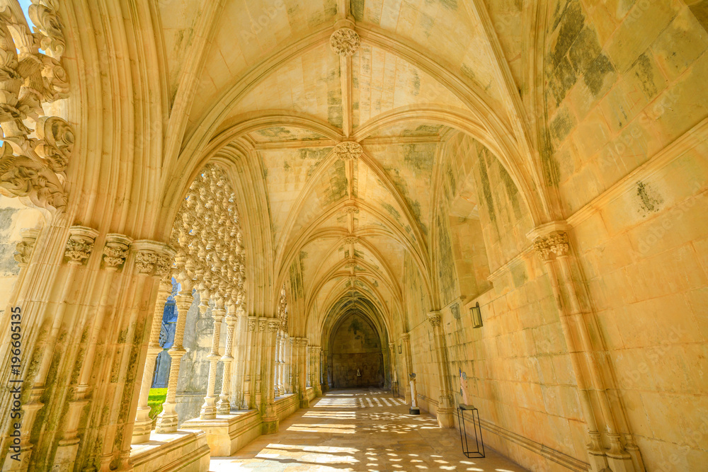Corridor and manueline colonnade of Royal cloister at Monastery of Batalha or Monastery of Saint Mary of the Victory in Leiria District, Central Portugal. Unesco Heritage.