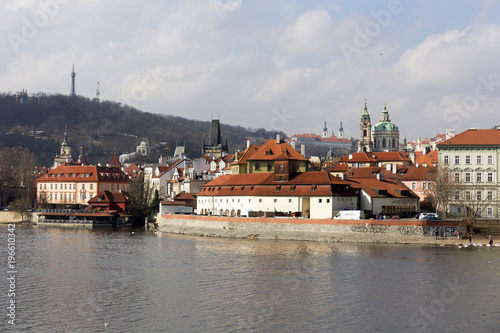 Early Spring Prague St. Nicholas' Cathedral with the Lesser Town above River Vltava in the sunny Day, Czech Republic