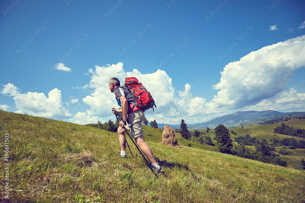 Hiking in the mountains in the summer with a backpack. Hiking in the mountains in the summer with a backpack.