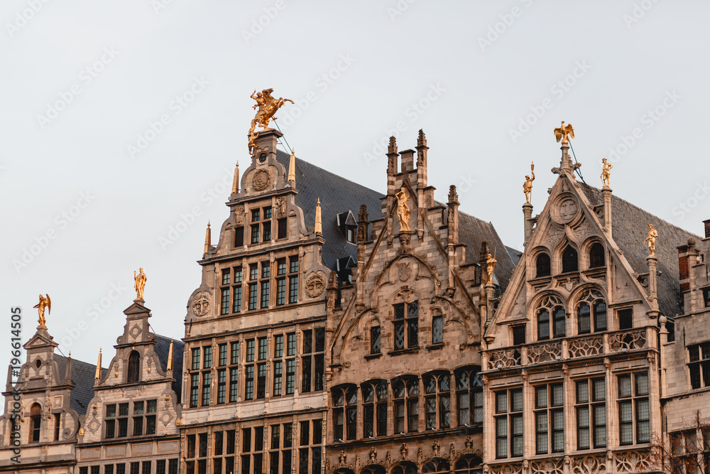 beautiful ancient buildings with sculptures in historical quarter of Antwerp, Belgium