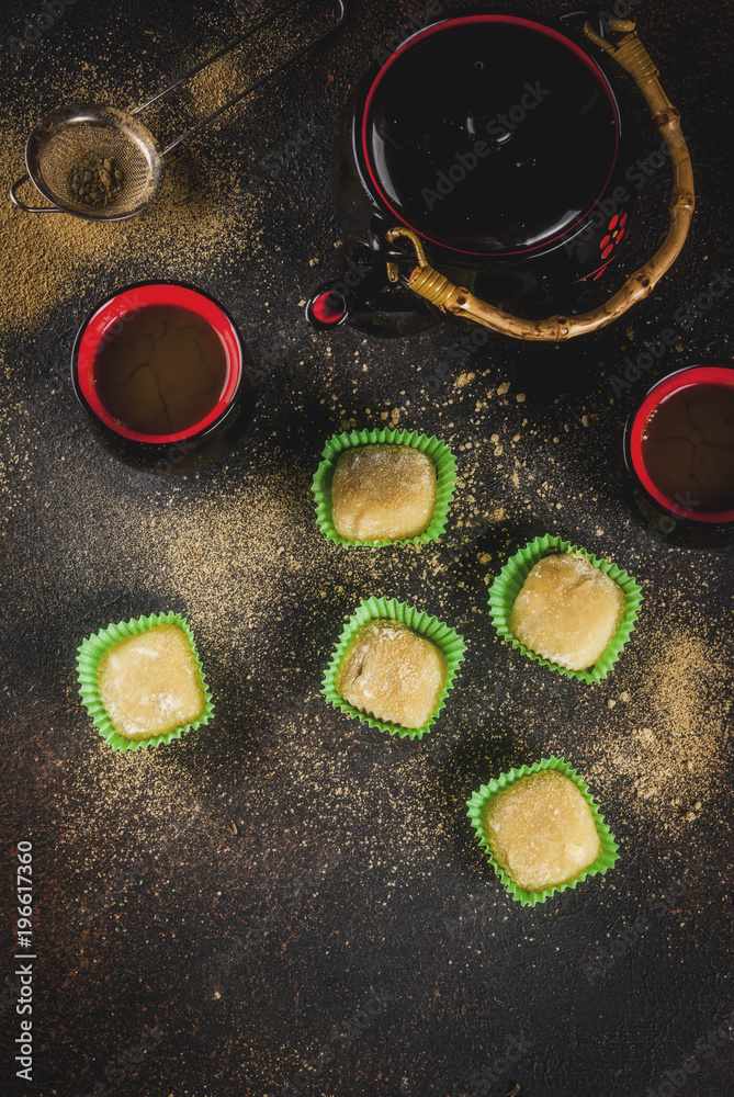 Matcha tea  with green mochi, dark rusty background. Copy space top view