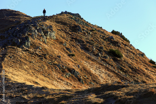 Poland, Tatra Mountains, Zakopane - Tourist hiking over the Pass under Kondracka Kopa near Czerwone Wierchy peaks