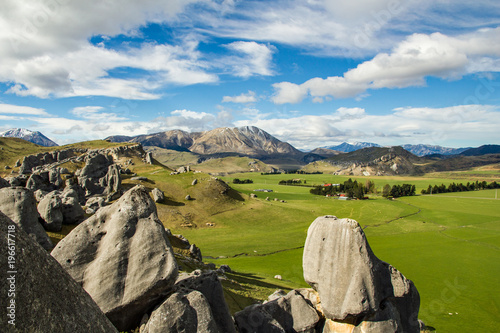 Castle hill rocks and surrounding pastoral countryside near Arthur’s pass in South Island, New Zealand photo