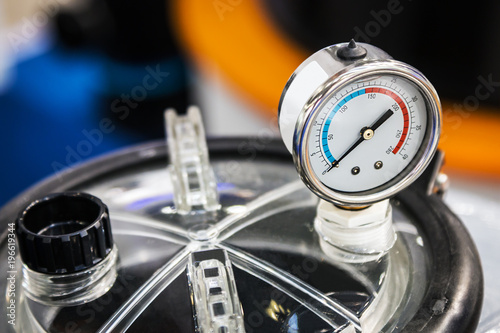 pressure gauge for measuring installed in water or gas systems. focus on the pressure gauge. Plumbing equipment, fittings, pipes, faucets, etc.