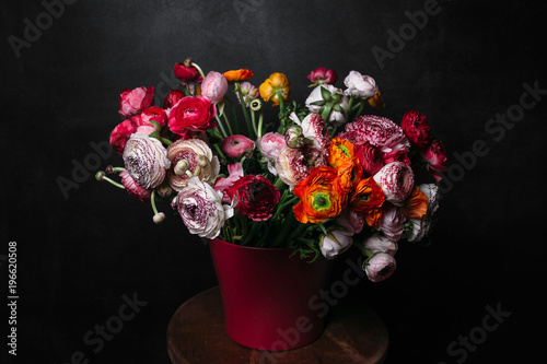 flower Ikibana on a black background, bouquet in a glass vase photo