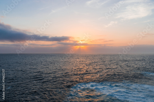 Hazy sunrise view over the ocean.