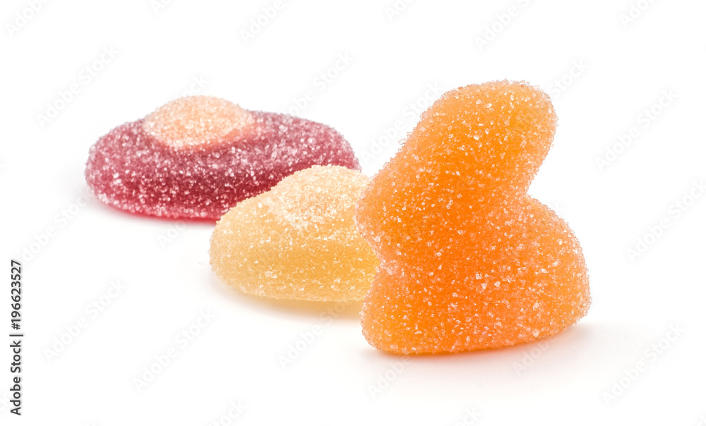 Orange Easter jelly bunny with two crimson and lemon eggs isolated on white background two marmalade sweets. Orange Easter jelly bunny with two crimson and lemon eggs isolated on white background two marmalade sweets.