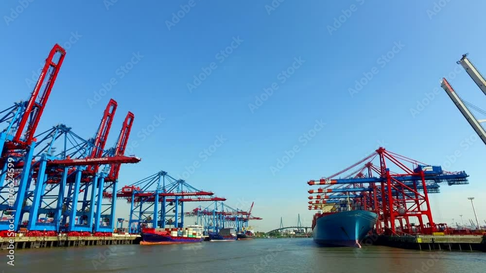 Container ships unload or load their cargo in the Port of Hamburg at the Burchartkai and Eurokai, Germany.