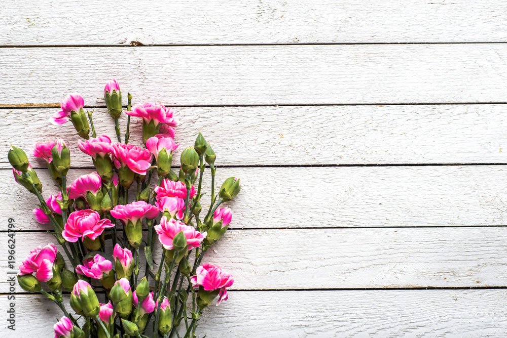 Spring flowers bouquet on table, overhead on white wooden background, flat lay, top view Spring flowers bouquet on table, overhead on white wooden background, flat lay, top view
