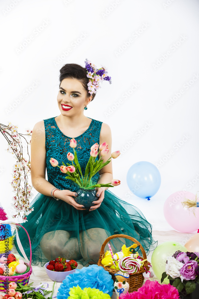 Beauty Woman with Spring Flower bouquet. Beautiful girl with a Bunch of colorful Tulip flowers. easter makeup and celebration hairstyle Beauty Woman with Spring Flower bouquet. Beautiful girl with a Bunch of colorful Tulip flowers. easter makeup and celebration hairstyle