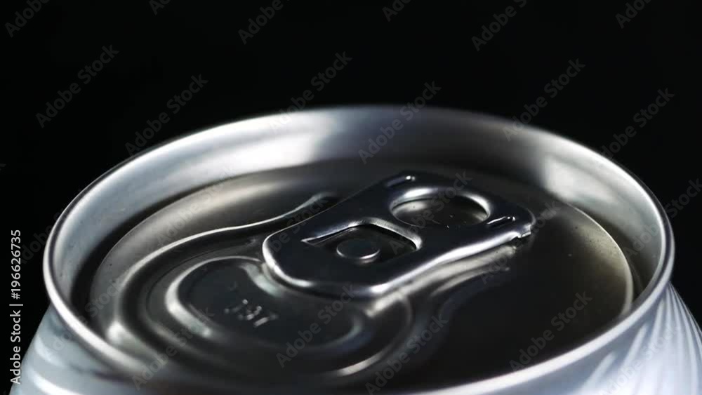 A cold drink rotates against a black background A cold drink rotates against a black background