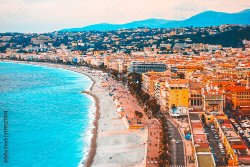 Colorful picture of nice, france with blue beach and traffic road in the middle without any logos