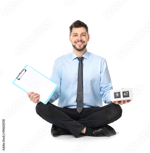 Young businessman with cloc...