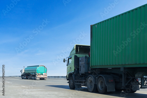 Truck on highway road with container, transportation concept.,import,export logistic industrial Transporting Land transport on the asphalt expressway with blue sky