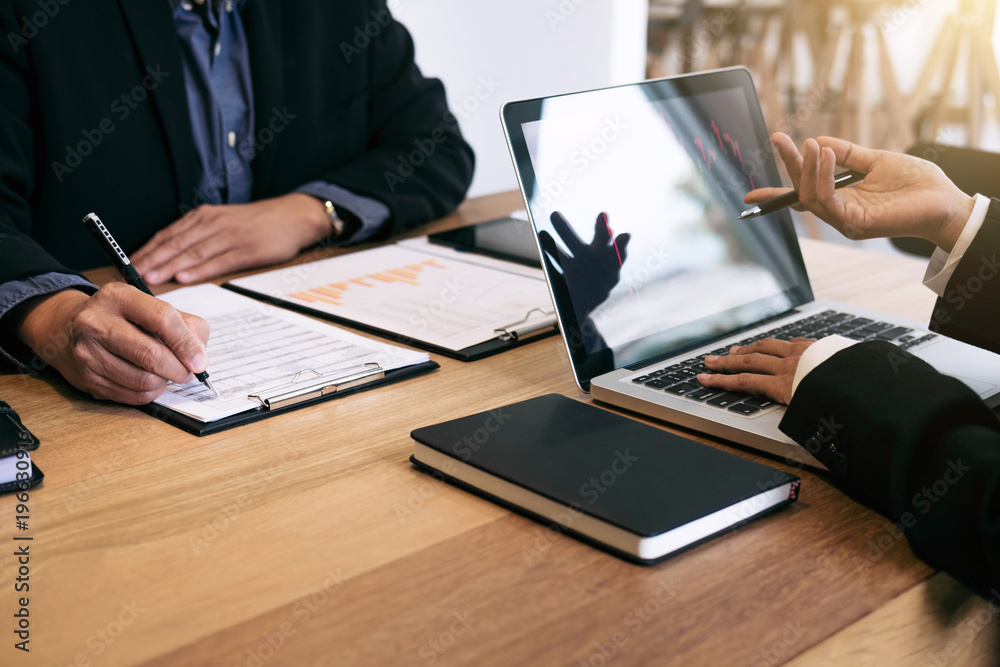 Business team investment working with computer and analysis graph stock market trading with stock chart data, business and technology concept Business team investment working with computer and analysis graph stock market trading with stock chart data, business and technology concept