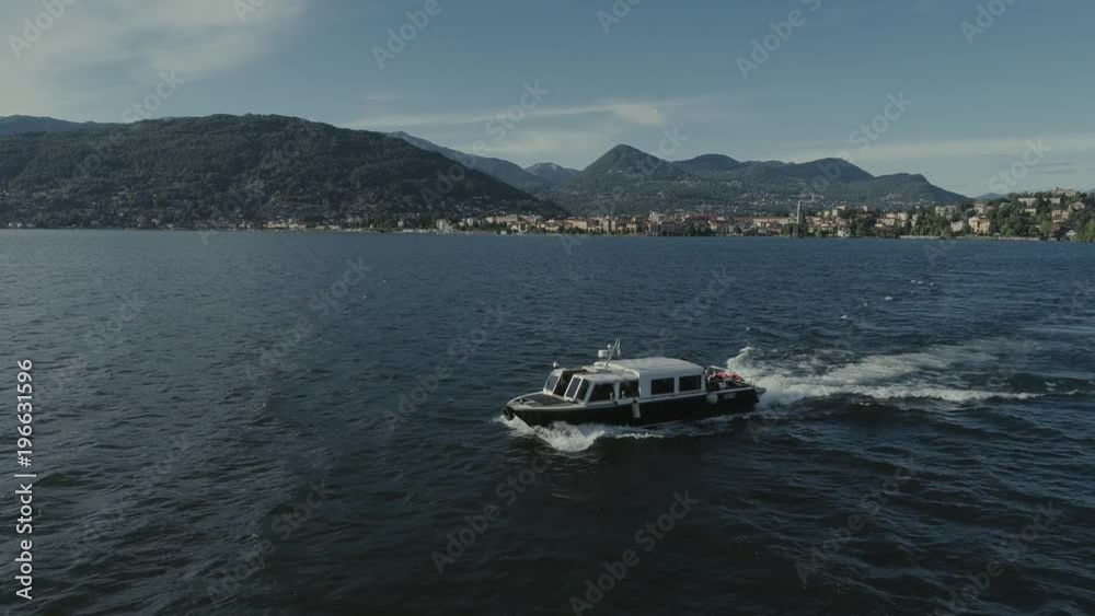 Passenger ship voyage on the mountain Italy lake, drone 4k nature flight Passenger ship voyage on the mountain Italy lake, drone 4k nature flight