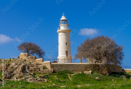 The ancient Odeon Amphitheatre and the lighthouse with olive tree. Paphos, Cyprus