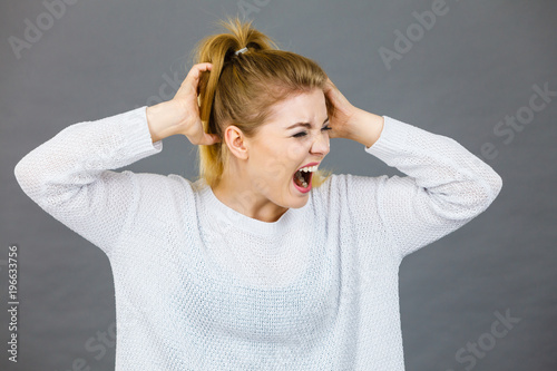 Wallpaper Mural Unhappy woman screaming and yelling in pain Torontodigital.ca