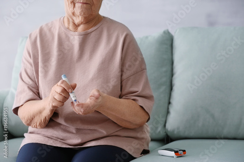 Elderly woman with diabetes...