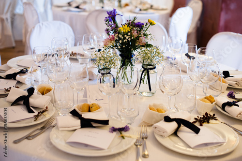 tables set for wedding gala dinner photo