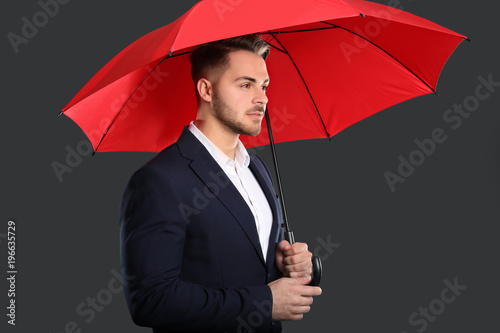 Young man in elegant suit w...