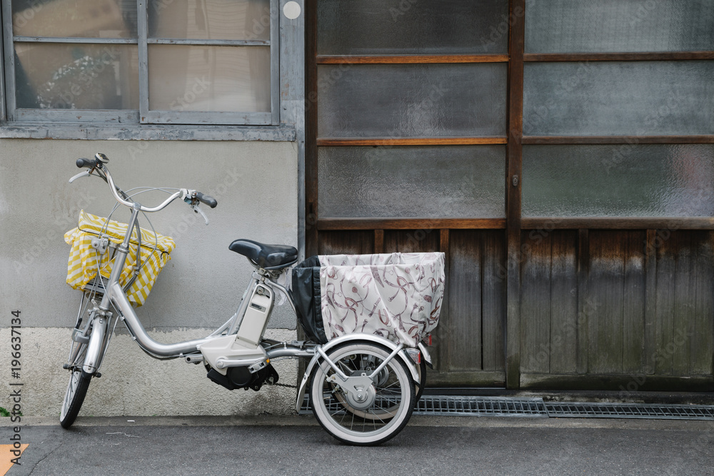 Bicycle in front of old Japanese house