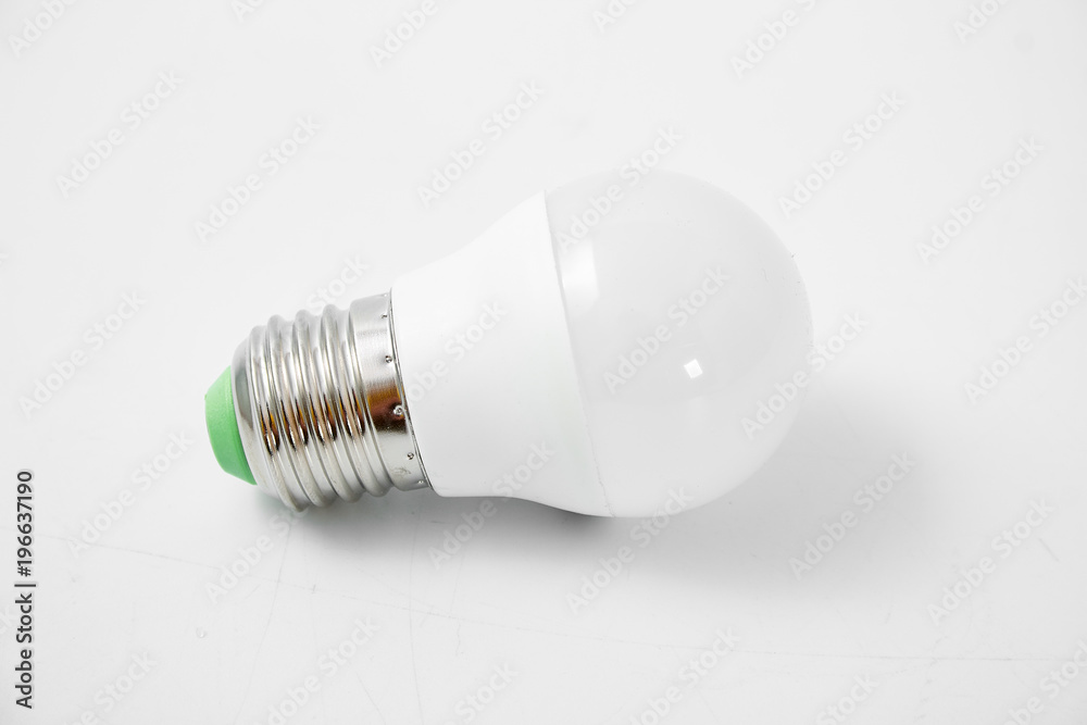 LED lamp with big cap on white background. LED lamp with big cap on white background.