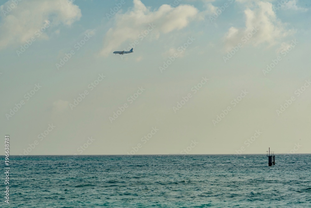 panorama of the Aruba island of the Caribbean with white sand and palm trees in the tropical scenery of the Netherlands Antilles at sunset panorama of the Aruba island of the Caribbean with white sand and palm trees in the tropical scenery of the Netherlands Antilles at sunset