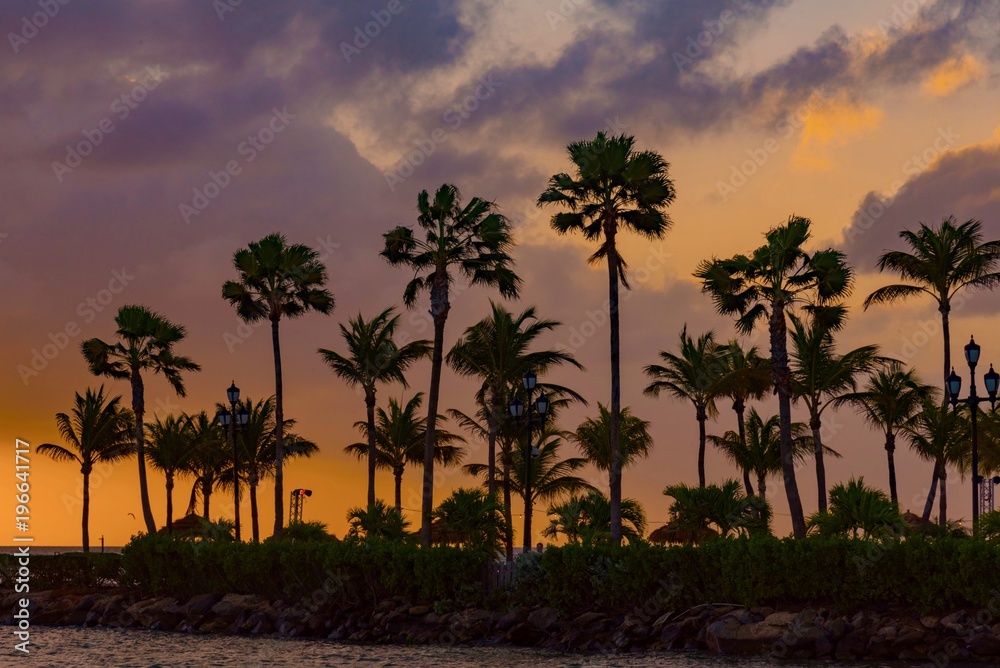 colorful sunset with boats in the ocean in the caribbean sea Island of Aruba